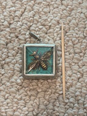Jewel Kade Brass Bee Pendant with Teal Background